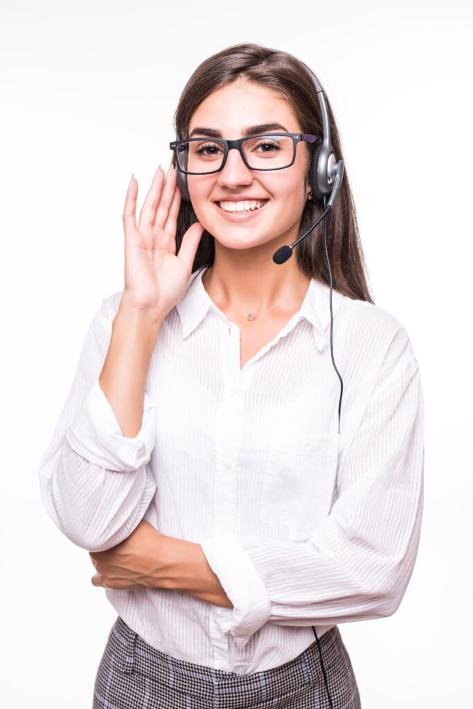 pretty smiling woman in transperent glasses, wide smile, white shirt with headset isolated on white wall